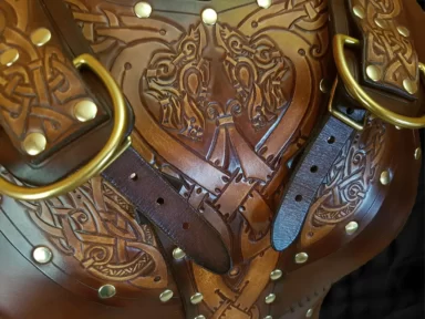 Sigrun leather armour showing front carving designs and shoulder strap details